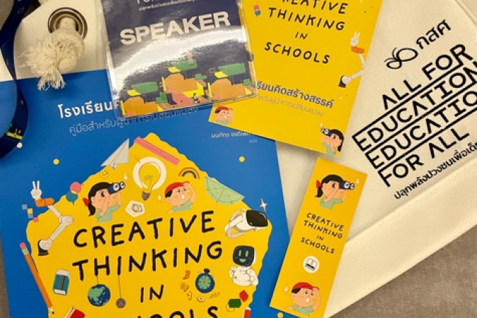 gift bags containing a copy of Creative Thinking in Schools: A Leadership Playbook in Thai